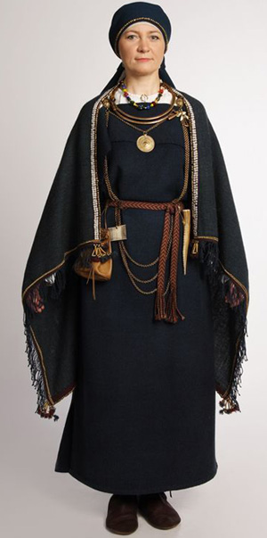 Female costume with leather accessories from Finland