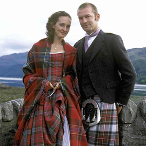Male and female national Scottish attire