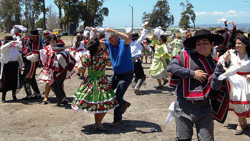 Chilean people dancing in traditional clothing