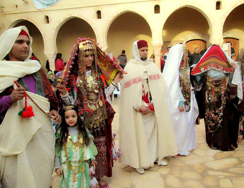 Tunisian men women and children in national costumes
