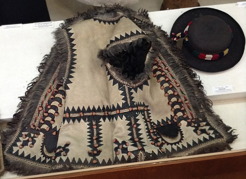 Sleeveless fur coat keptar made from sheepskin and male hat kresanya