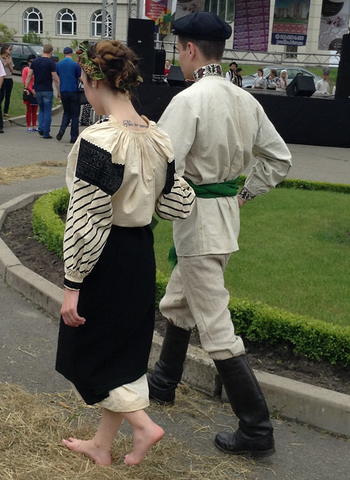 Traditional male and female costumes of unmarried couple from Sharhorod district Vinnytsia region of Ukraine