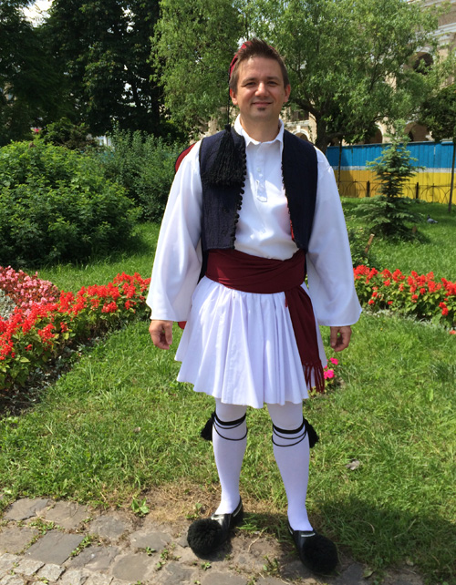 Greek man in traditional costume based on foustanella skirt