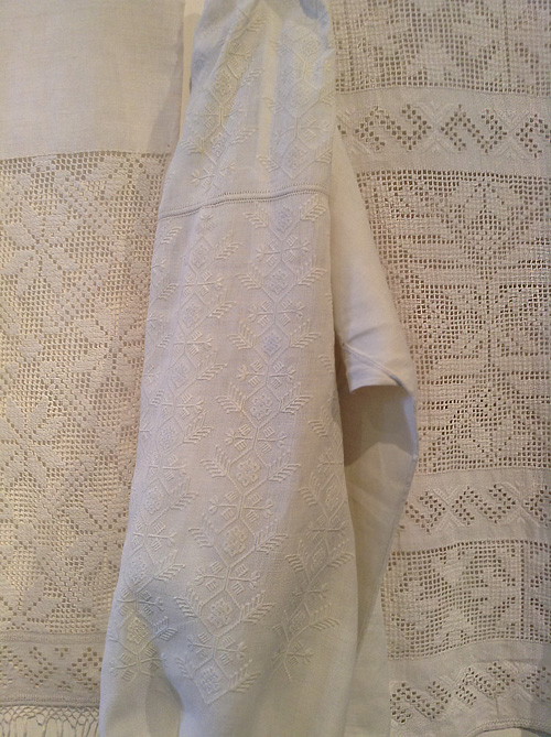 Ukrainian folk needlework on embroidered shirt and ceremonial towels