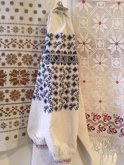 Ukrainian traditional needlework on embroidered shirt and ceremonial towels