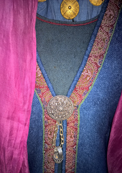 Silver brooch on clothing 10th century Reconstruction