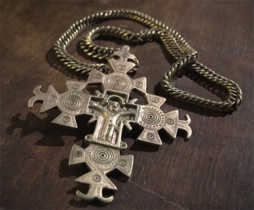 Decorative brass cross on a chain made by Ukrainian craftsmen from western Ukraine Carpathian region Kobrynsky National Museum of Folk Art