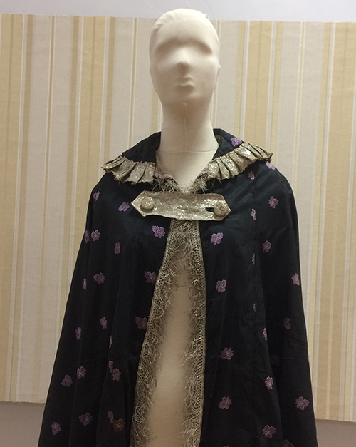 Cape with golden brocade trimming from late 19th – early 20th century
