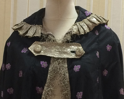 Cape with golden brocade trimming from late 19th – early 20th century
