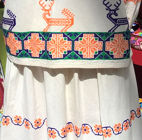 Interesting needlework pattern on Mexican women’s outfit