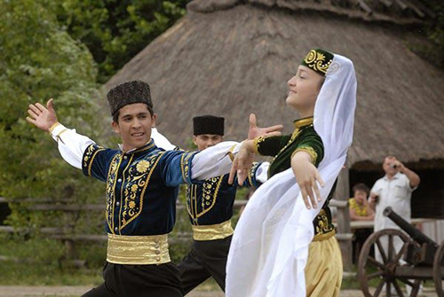 Crimean Tatars dancing in folk costumes