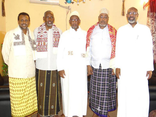 Somalian men wearing sarong kamis and koofiyad