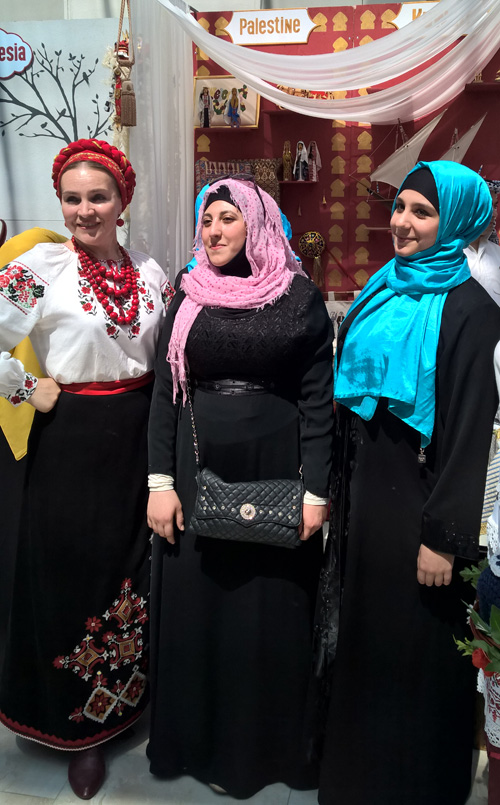 Women in Ukrainian outfit on the left and Muslim clothing on the right