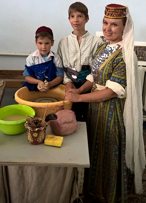 Crimean Tatar family of potters in folk costumes