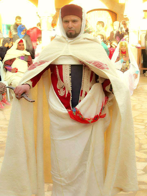 Tunisian man in traditional costume and with ceremonial knife