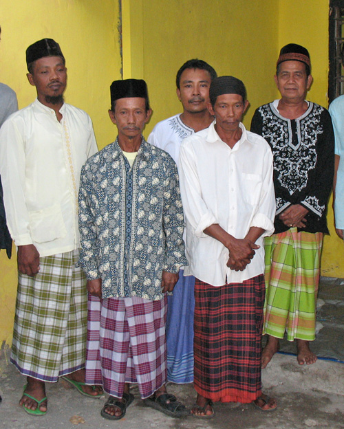 Javanese men in sarong baju koko and peci
