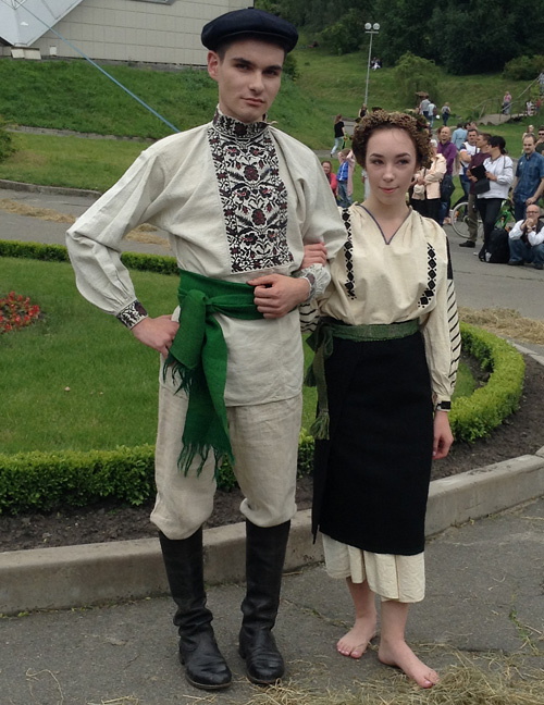 Traditional male and female costumes of unmarried couple from Sharhorod district Vinnytsia region of Ukraine