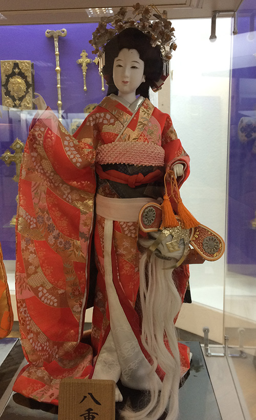 Japanese doll wearing traditional attire