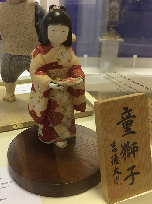 Japanese doll wearing traditional clothing