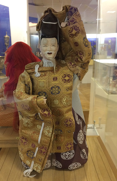 Japanese doll wearing traditional clothing