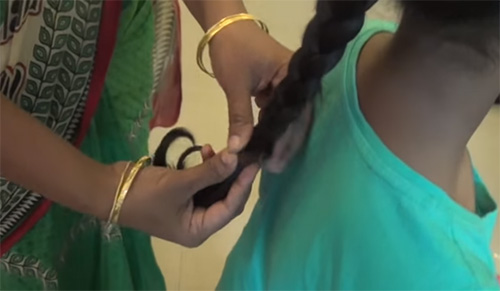 Traditional Indian hairdo for Bharatanatyam folk dance -  