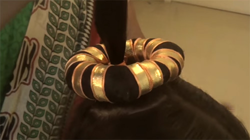 Traditional Indian hairdo for Bharatanatyam folk dance -  
