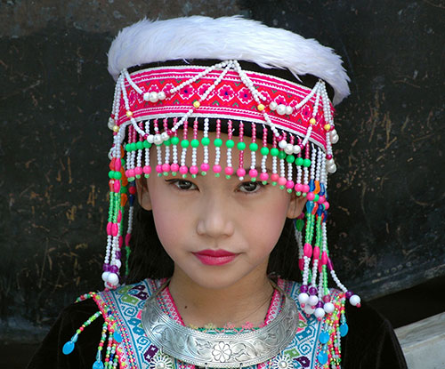 Thai Hmong girl in traditional headpiece