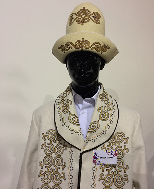 Kyrgyz men's traditional coat and kalpak made from white wool