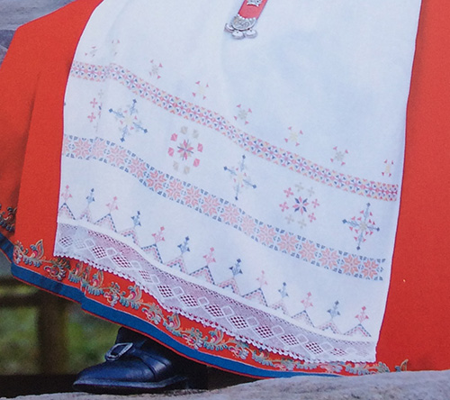Norwegian traditional apron decorated with embroidery and lace
