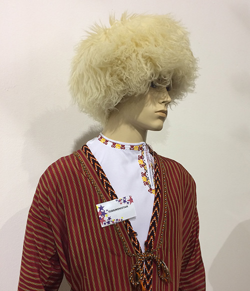 Modern replica of Turkmen traditional male attire with white Turkmen telpek