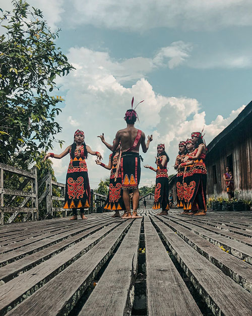 Indonesian tribal folk dancers in aboriginal clothes