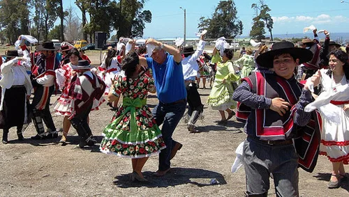 Traditional costume of Chile. Flowered dresses, chamantos and chupalla hats