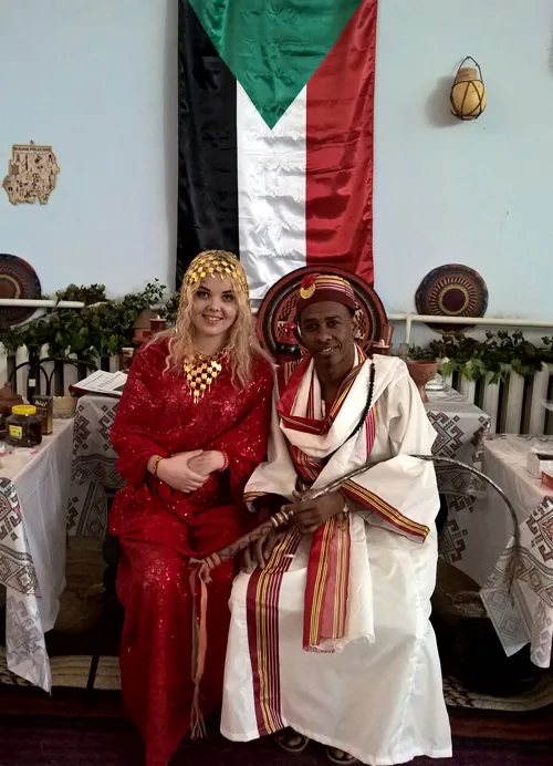 National dress of Sudan. Men prefer loose-fitting robes and women use wrap-around cloths