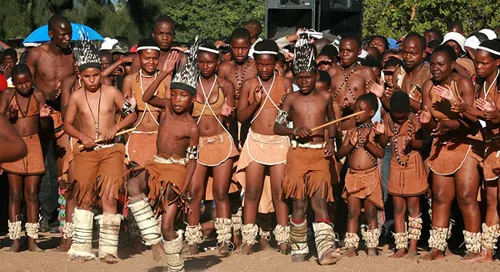 Traditional clothing of Botswana. Modest European dress combined with kaross or woven blanket