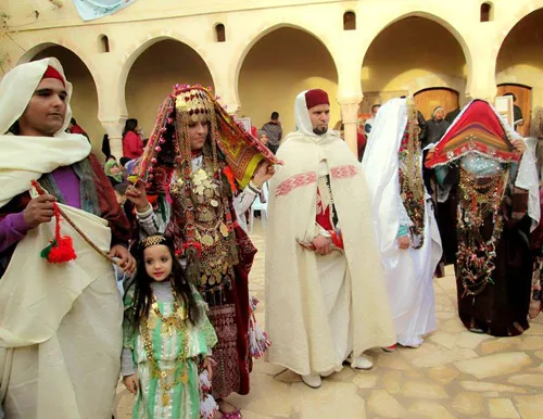 Traditional dress of Tunisia. Intricate embroidered patterns and plenty of gold jewelry