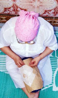 Tunisian woman in the process of embroidering