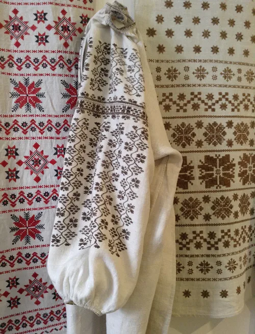 traditional needlework on embroidered shirt and ceremonial towels from central Ukraine
