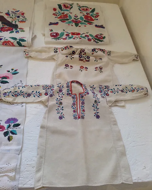 Floral embroidery designs on little girls’ shirts and festive towels