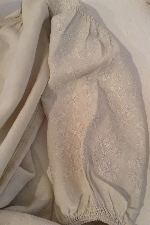 Ukrainian whitework on the sleeve of female shirt