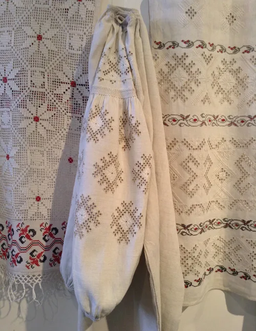 Ukrainian traditional needlework on embroidered shirt and ceremonial towels