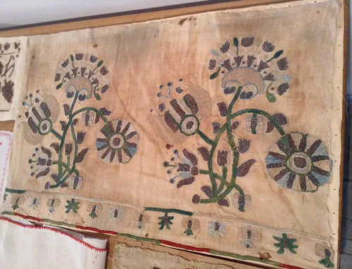 vintage needlework pattern on embroidered towel from 17th century