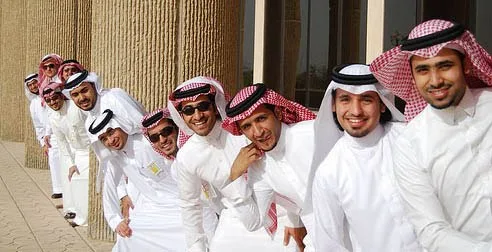 UAE traditional clothing. Emirati men and women cover their heads and bodies