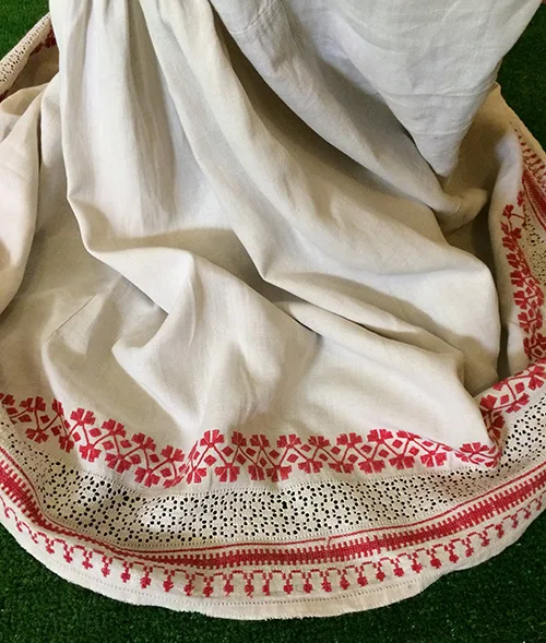 Women’s embroidered shirt and coral necklace from Ukraine early 20th century