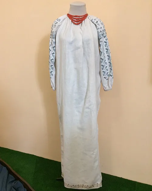Women’s embroidered shirt and coral necklace from Ukraine early 20th century