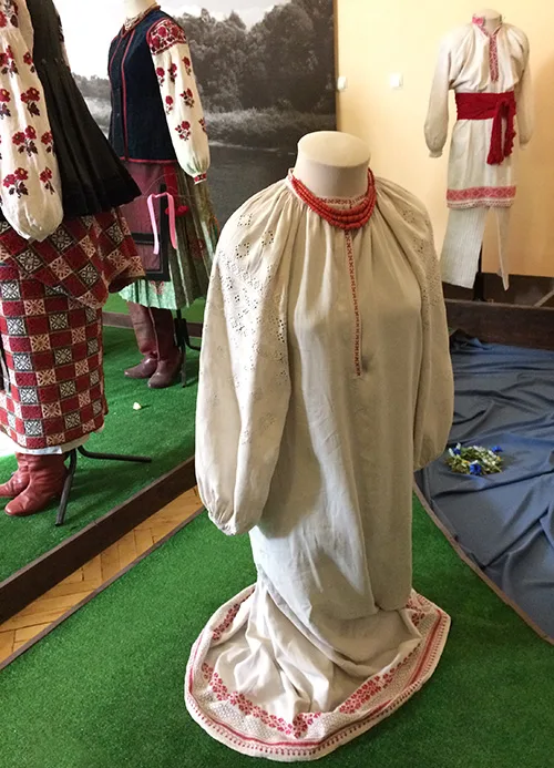 Women’s embroidered shirt and coral necklace from Ukraine early 20th century