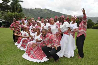 Traditional clothing of Jamaica. Modest dresses from bandana fabric and shoes from washed-up materials