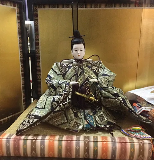 Japanese doll wearing traditional clothing