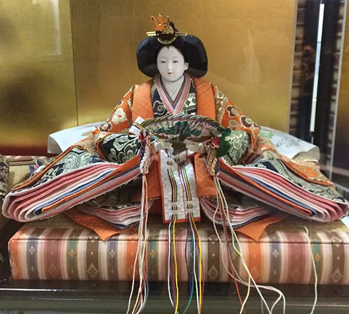 Japanese doll wearing traditional clothing