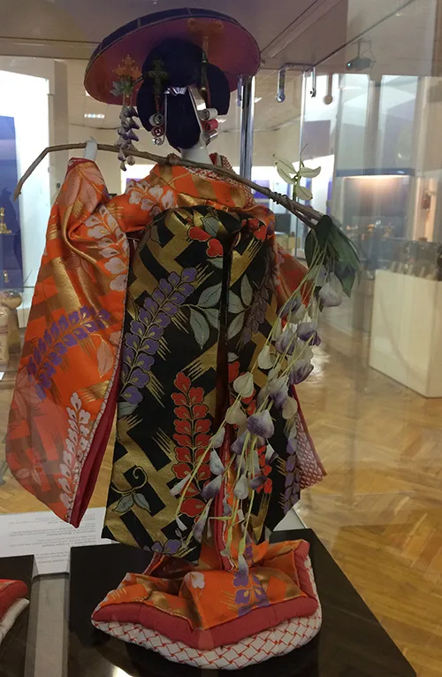 Beautiful Japanese doll wearing traditional clothing