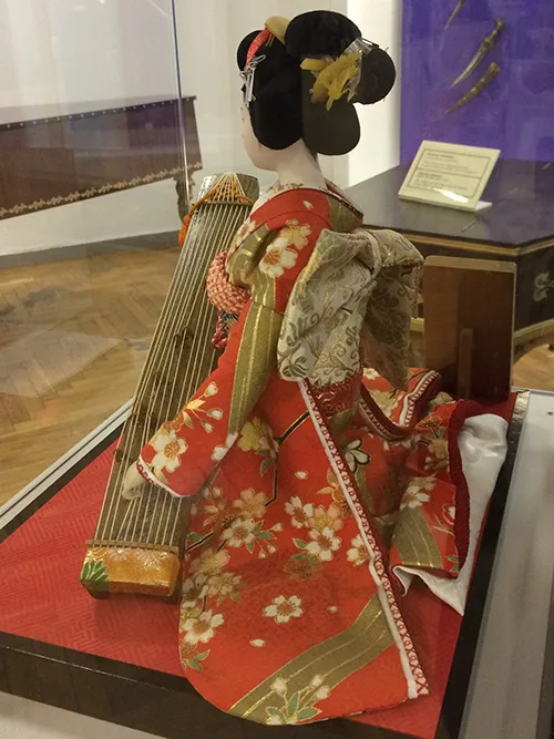 Lovely Japanese doll wearing traditional clothing